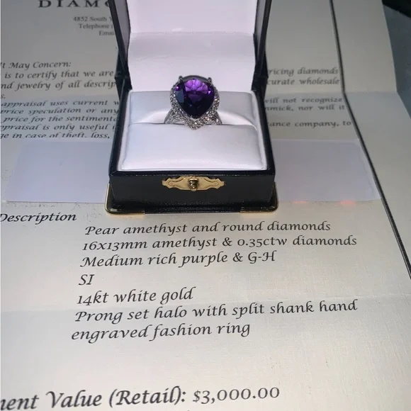 NWpaperwork. Pear Amethyst and round diamond ring.